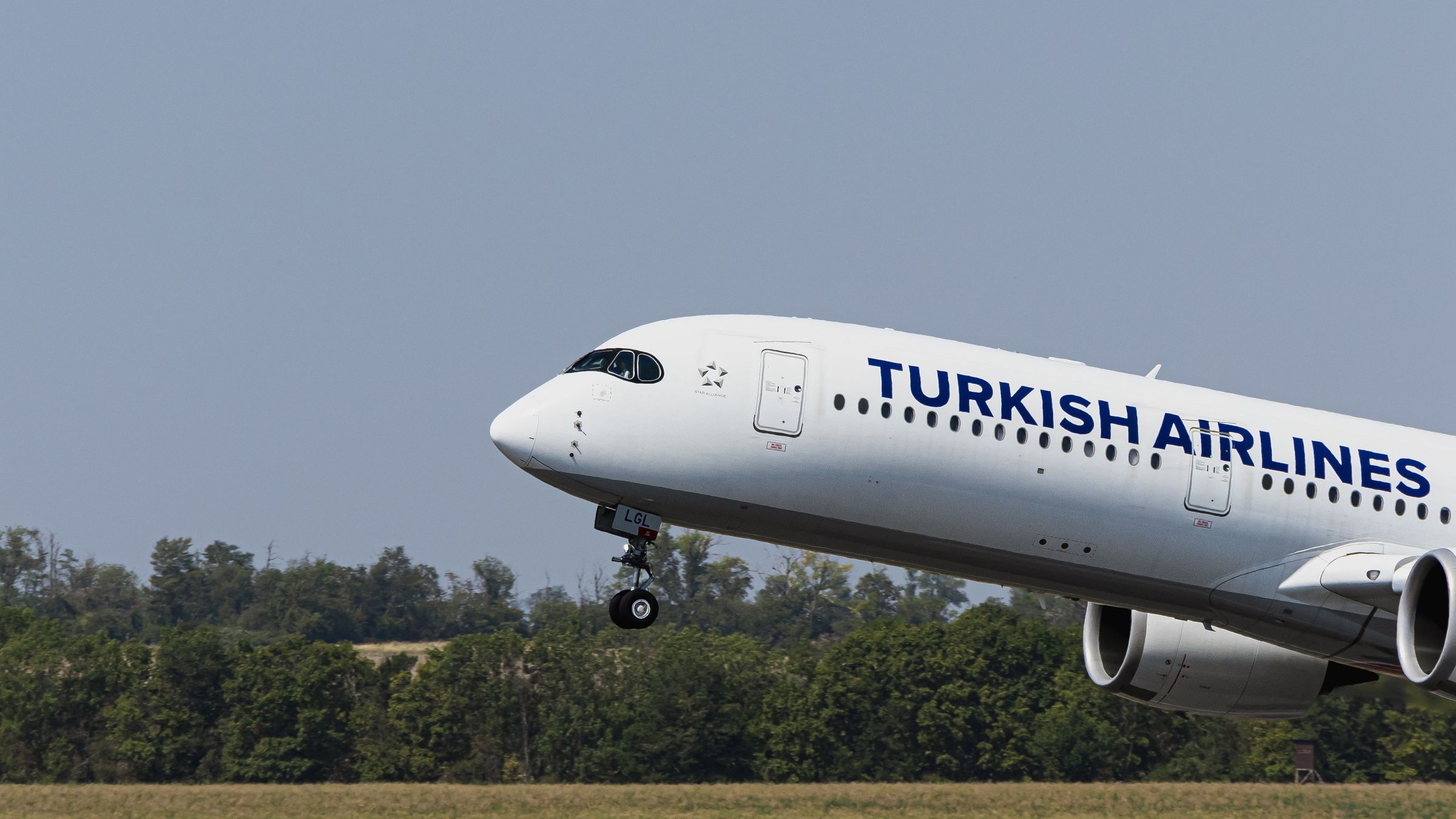 Turkish Airlines Airbus A350 rotating during takeoff, nose gear just clearing the runway